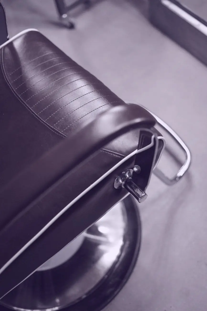 Close view of a leather barber chair back and its chrome frame